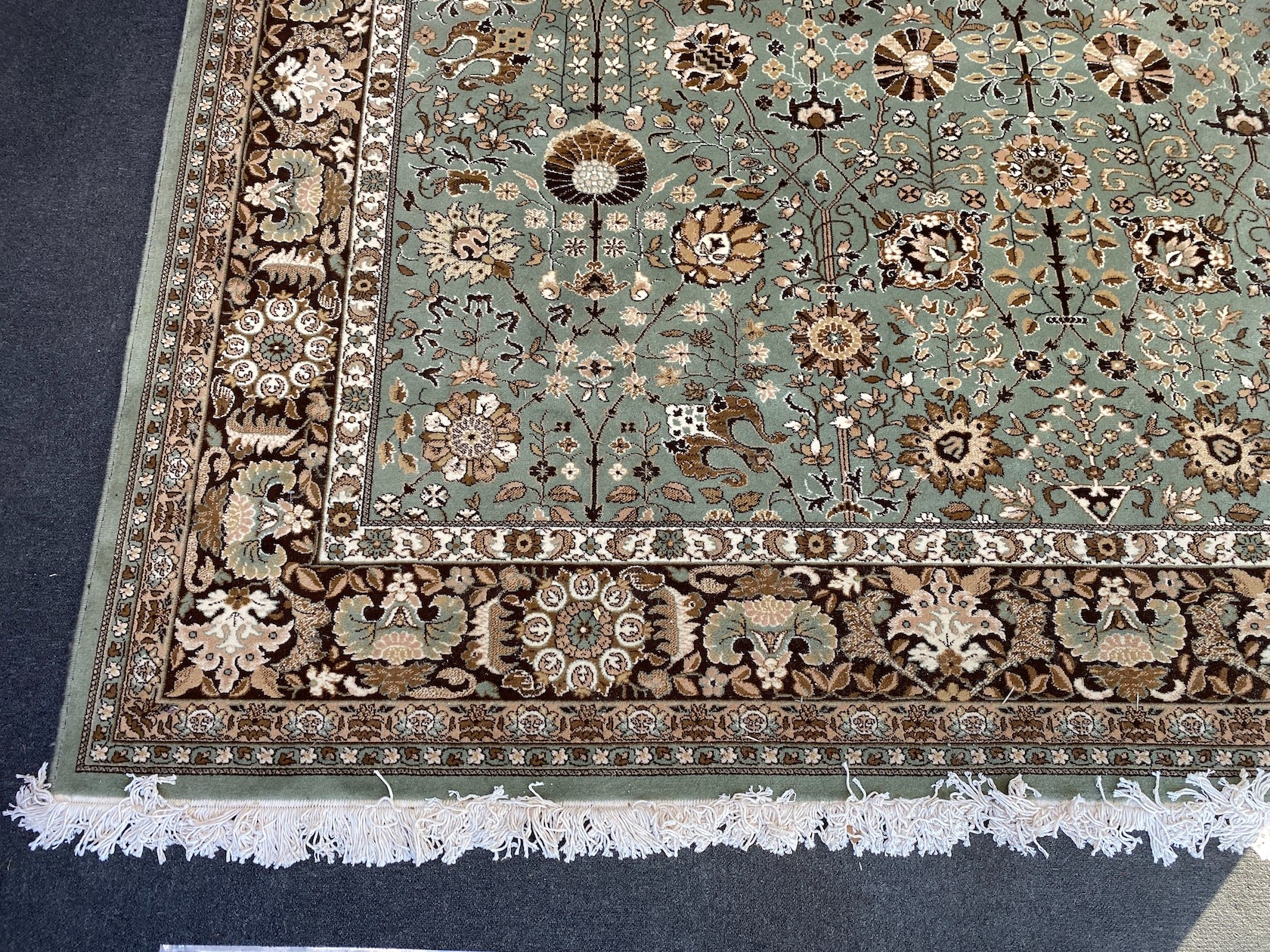 A Tabriz style green ground carpet, 400 x 300cm